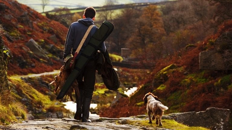 Hunter with dog courtesy of Pixabay